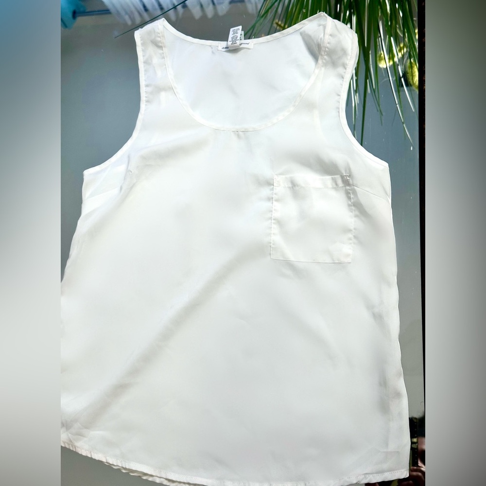 See through white sleeveless top